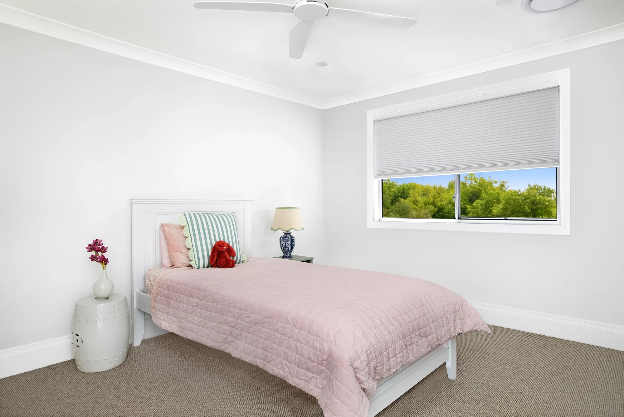 Honeycomb blinds in girls bedroom
