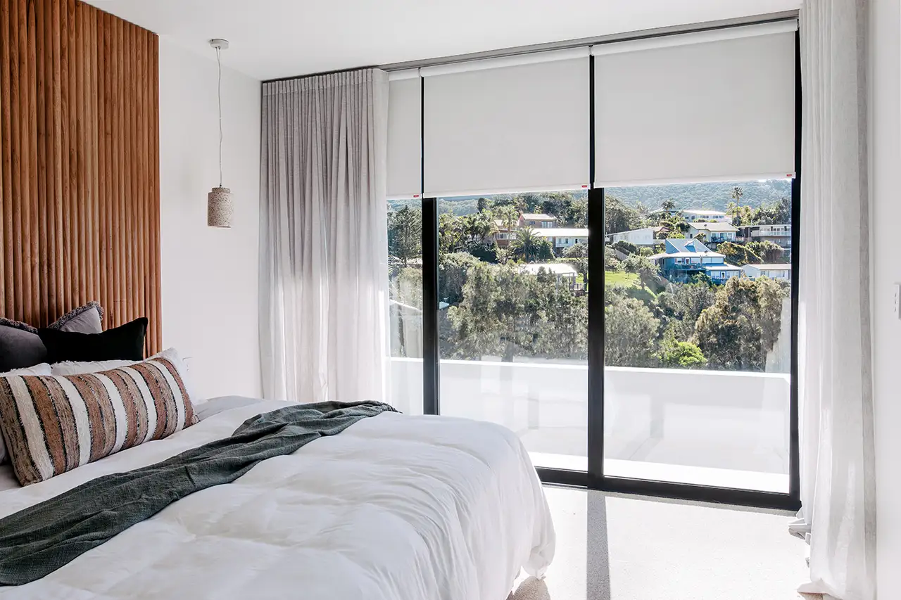 Sheer curtains placed over blockout blinds