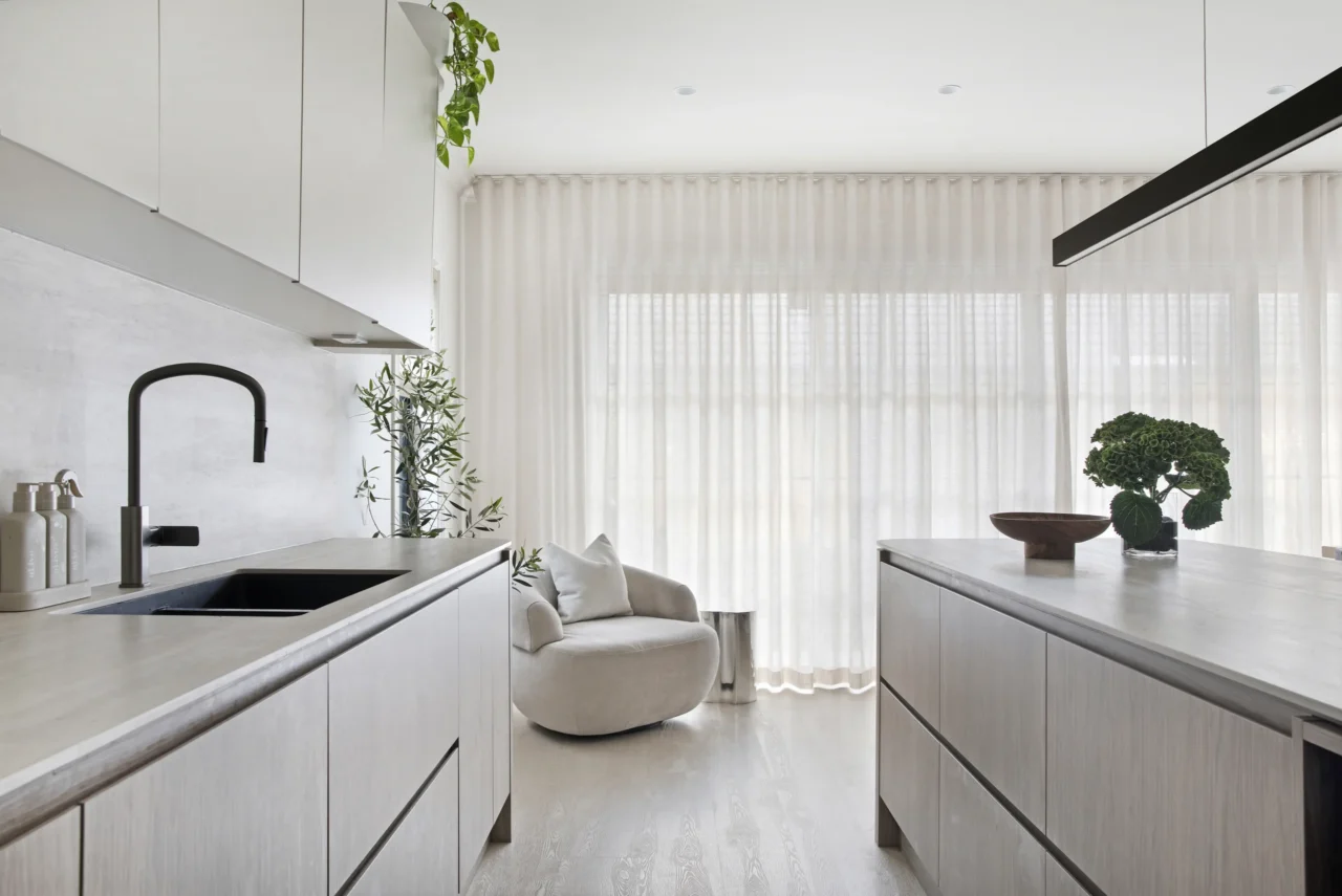 sheer curtains in Rejuvenate Linen wave fold across full-width sliding glass wall in Sydney dining room